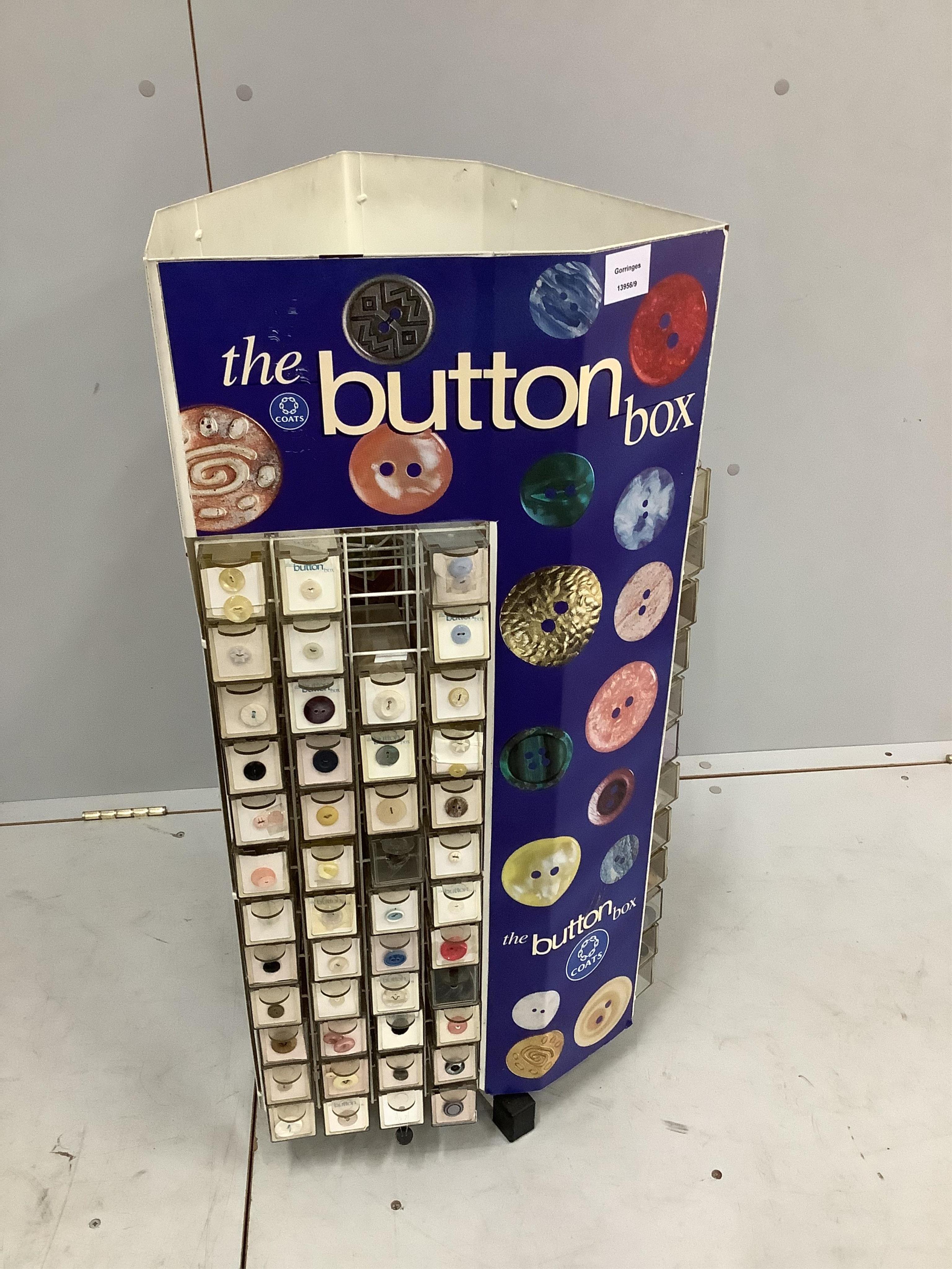 A Coats 'button box’ haberdasher's button display carousel, with a quantity of assorted buttons, width 39cm, height 86cm. Condition - fair